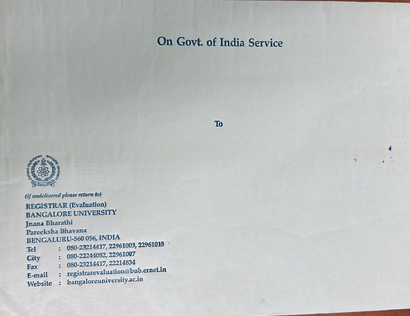 Bangalore University transcript envelope sealed and stamped across the back flap by the Registrar (Evaluation)